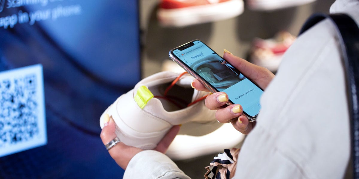 Someone scanning a product with an app