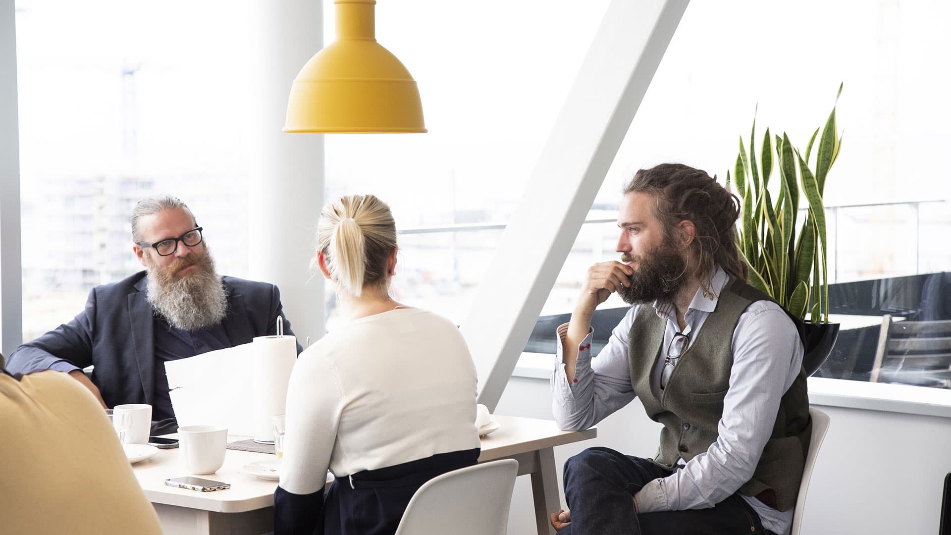 People sitting in a meeting, discussing